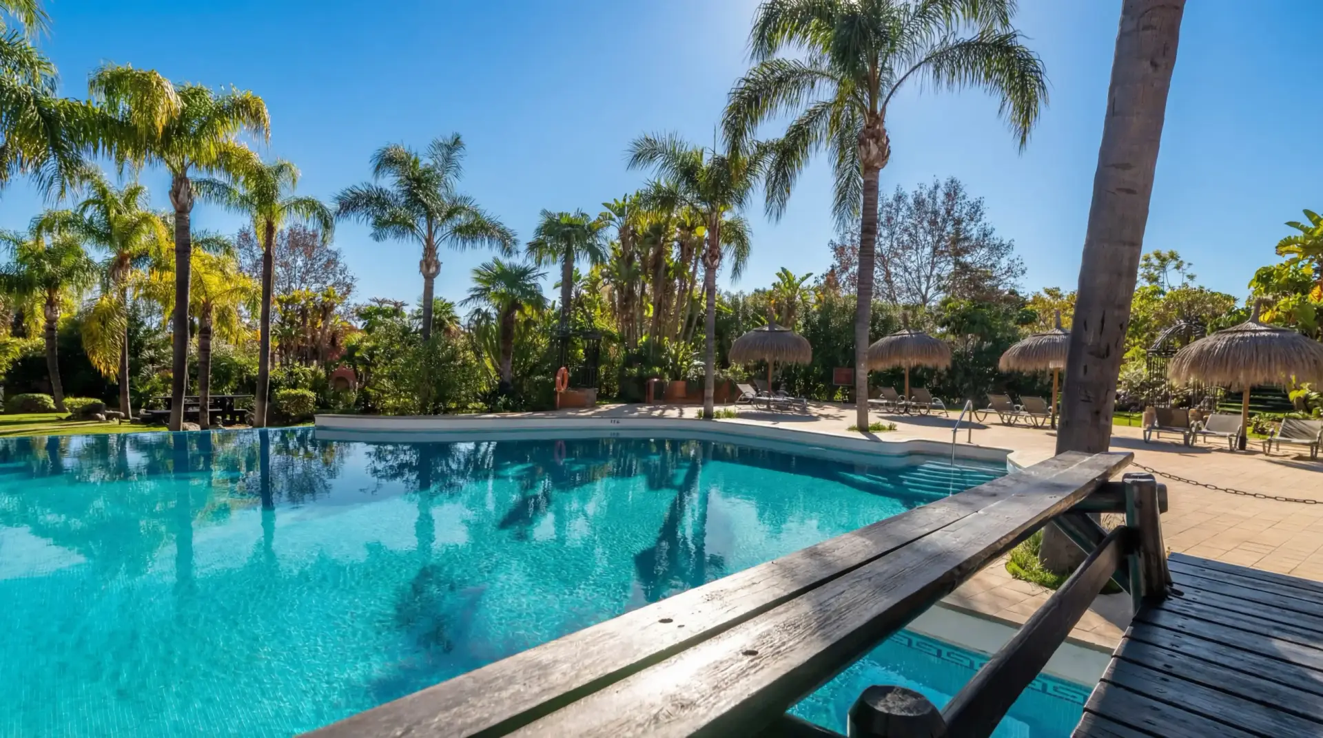 Luxury duplex penthouse in Nueva Andalucía Marbella with panoramic sea views, giant rooftop terrace, BBQ area, outdoor dining, and walking distance to Puerto Banús beach and marina.