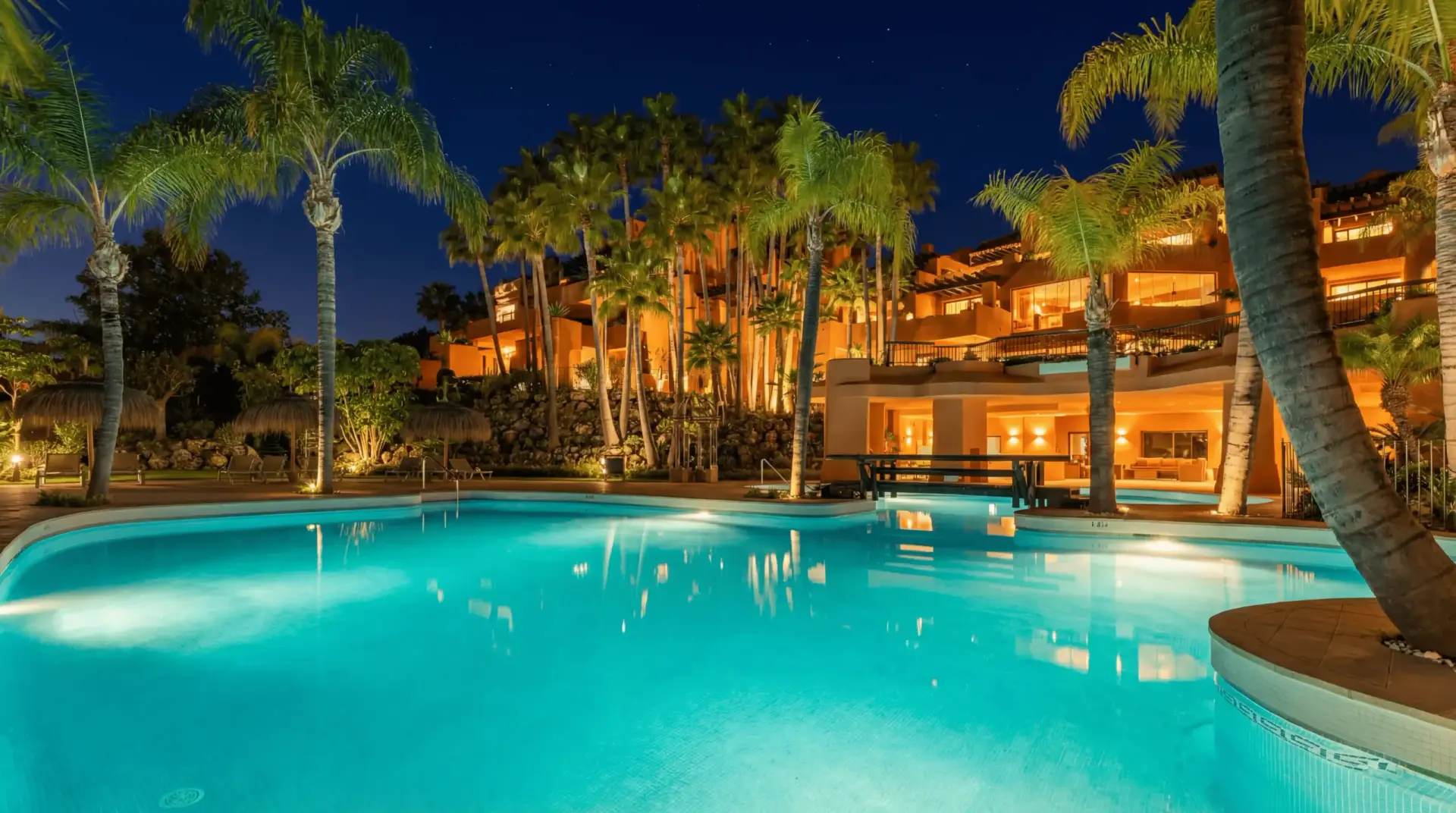 Luxury duplex penthouse in Nueva Andalucía Marbella with panoramic sea views, giant rooftop terrace, BBQ area, outdoor dining, and walking distance to Puerto Banús beach and marina.