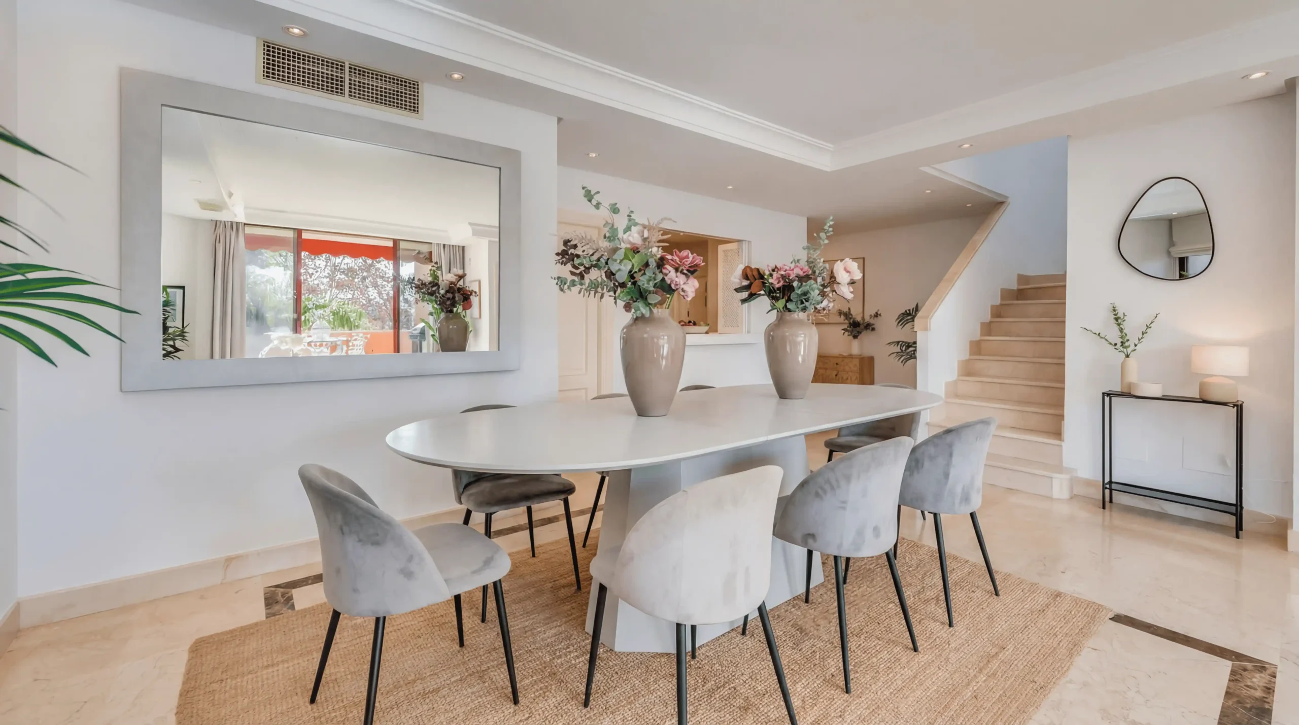 Luxury duplex penthouse in Nueva Andalucía Marbella with panoramic sea views, giant rooftop terrace, BBQ area, outdoor dining, and walking distance to Puerto Banús beach and marina.