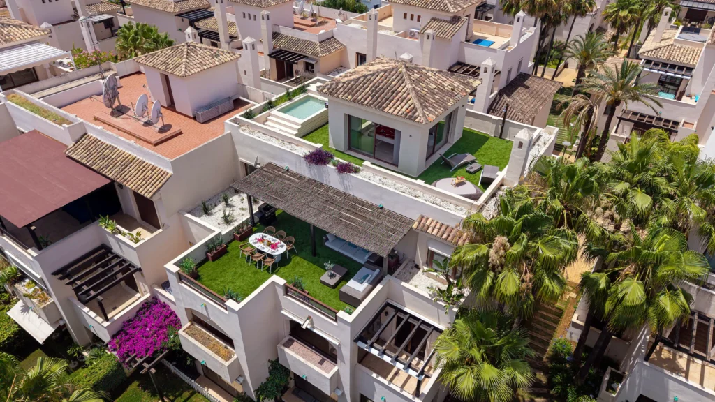 Luxury penthouse Marbella Nueva Andalucía aerial view with private heated pool, rooftop solarium, Golf Valley location, luxury terrace and panoramic views of Costa del Sol Spain near Puerto Banús